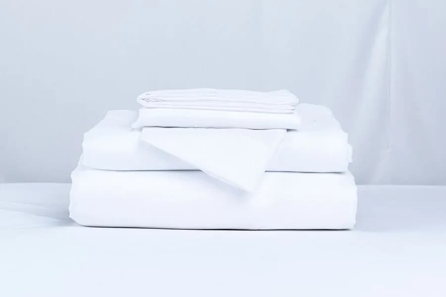 Juego de sábanas blancas dobladas, catálogo de sábanas al por mayor